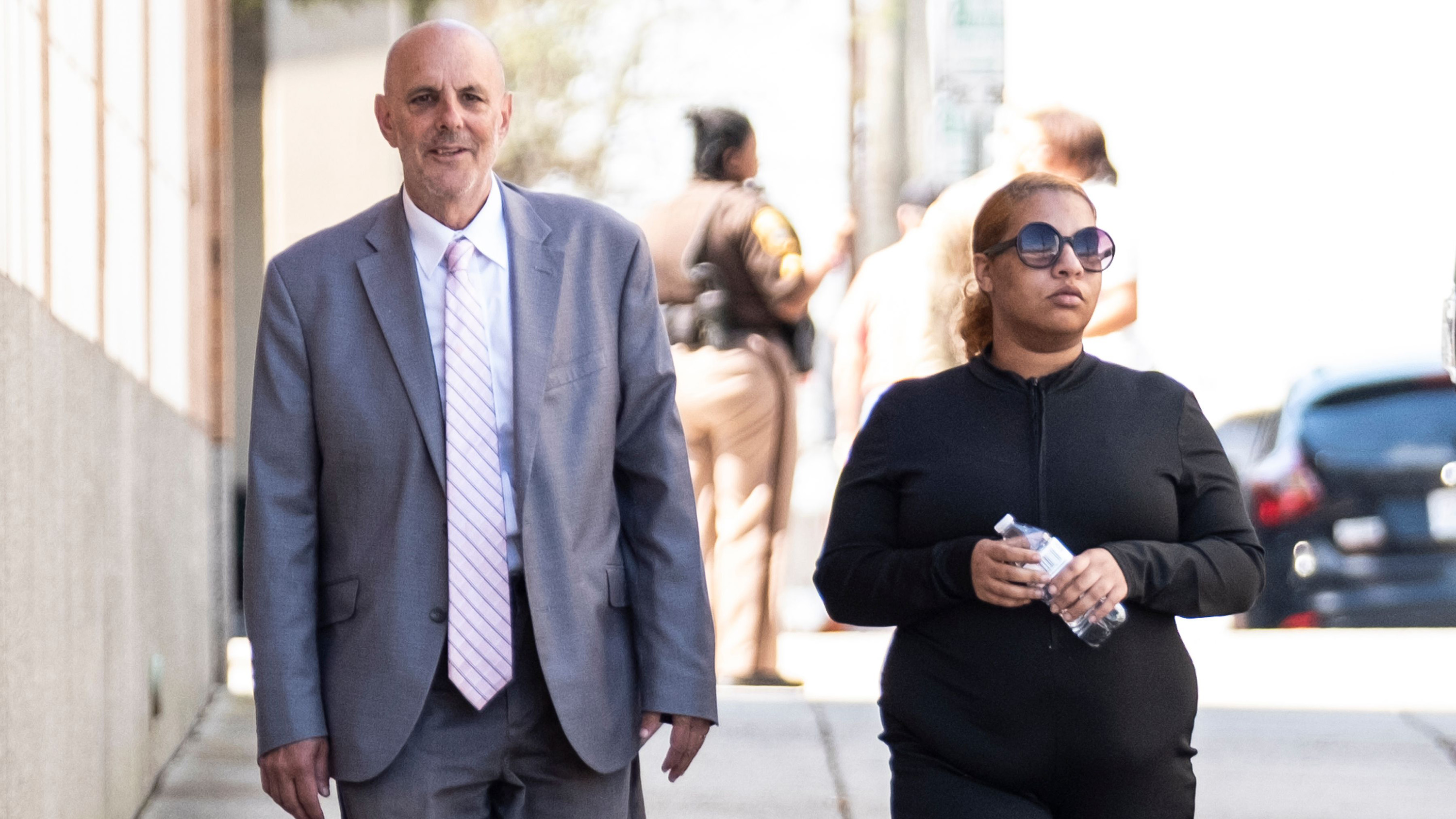 Deja Taylor, right, arrives with attorney James Ellenson to the Newport News Sheriffs Office in Newport News, Virginia, on April 13, 2023, to turn herself in.