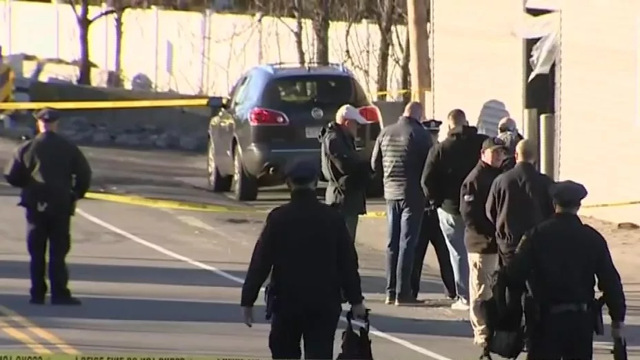 Norwood parking lot standoff ends with officer shooting armed suspect