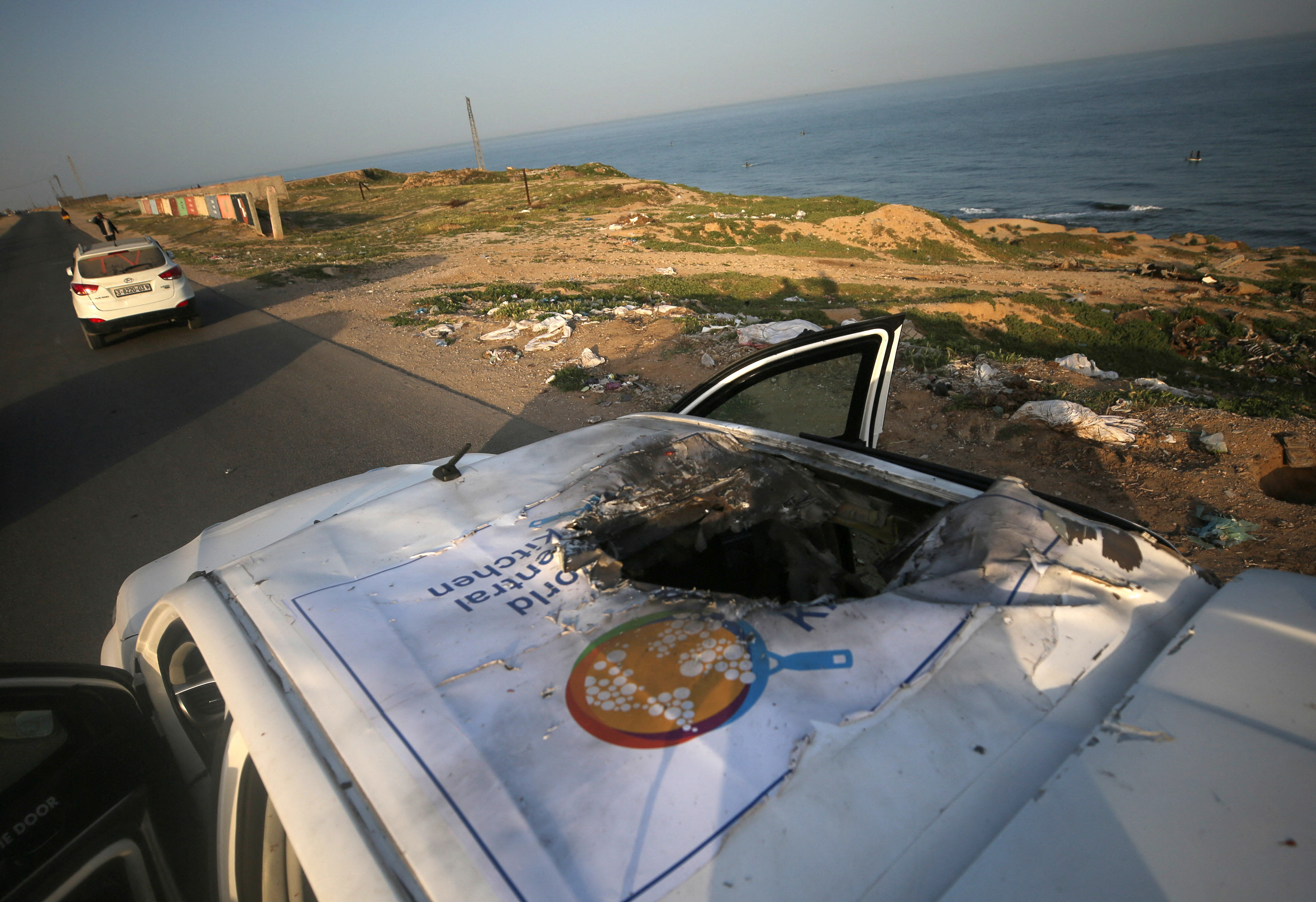 A view of the destroyed roof of a vehicle where employees from the World Central Kitchen (WCK), including foreigners, were killed in an Israeli airstrike, according to the NGO as the Israeli military said it was conducting a thorough review at the highest levels to understand the circumstances of this "tragic" incident, amid the ongoing conflict between Israel and Hamas, in Deir Al-Balah, in the central Gaza, Strip April 2, 2024. (Photo by Yasser Qudihe / Middle East Images / Middle East Images via AFP) (Photo by YASSER QUDIHE/Middle East Images/AFP via Getty Images)